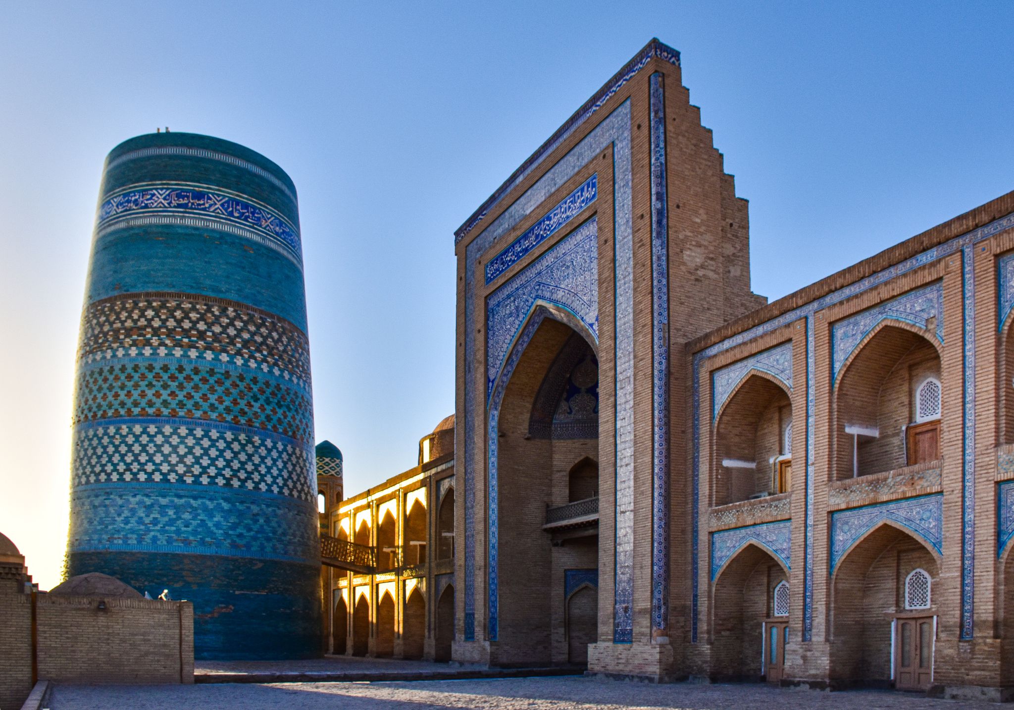 Kalta Minor Minaret with Mohammed Amin Khan Madrassah in Khiva, Uzbekistan, a stunning example of Central Asian architecture.